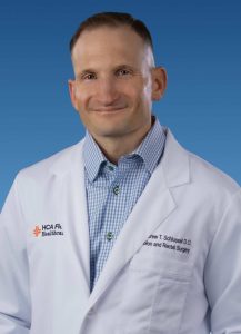 Dr. Schlussel Headshot in white coat