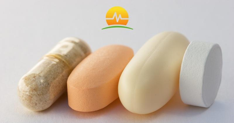 One white soft pill, an orange pill, and a brown pill